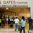 People make their way through Love Field airport Friday, May 28, 2021, in Dallas. (AP Photo/LM Otero)