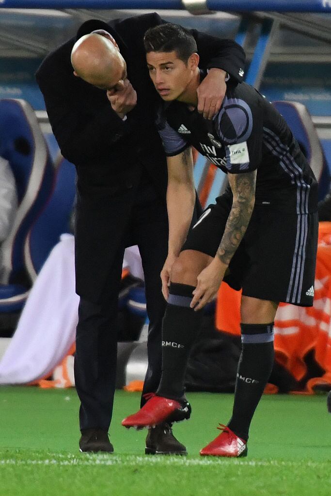 YOKOHAMA, JAPAN - DECEMBER 15:  Zinedine Zidane,coach (L) and James Rodriguez of Real Madrid look on during the FIFA Club World Cup Semi Final between Club America and Real Madrid at International Stadium Yokohama on December 15, 2016 in Yokohama, Japan.  (Photo by Masashi Hara/Getty Images)
