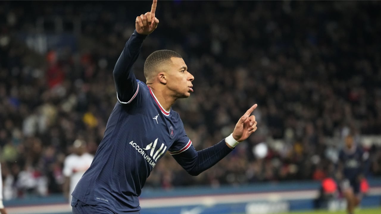 PSG's Kylian Mbappe celebrates after scoring his side's second goal during the French League One soccer match between Paris Saint Germain and FC Lorient at Parc des Princes stadium in Paris, Sunday, April 3, 2022. (AP/Michel Euler)