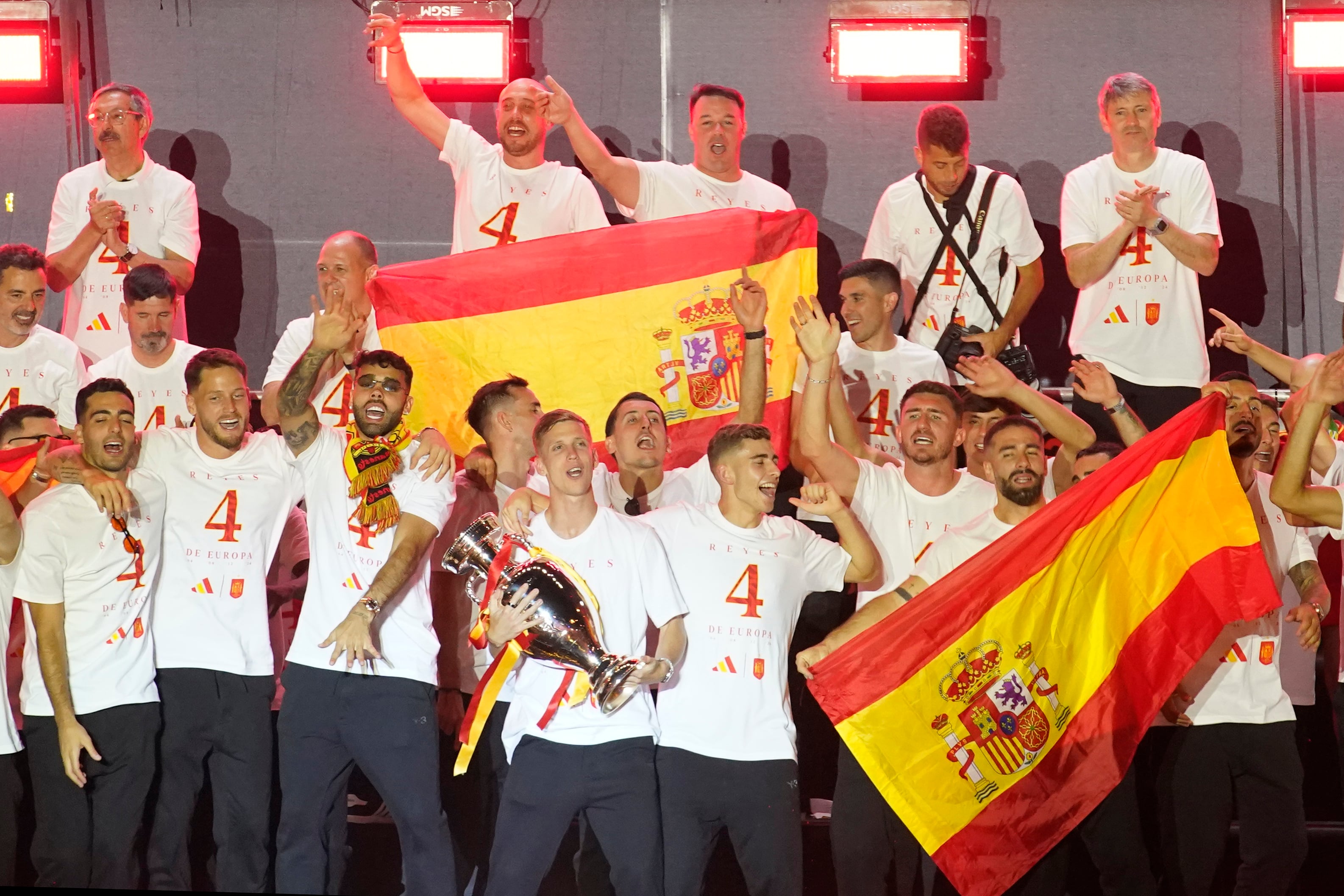 Spain's Dani Olmo holds the trophy during celebrations of the Spanish team's European soccer championship title on a stage at Cibeles square in Madrid, Monday, July 15, 2024. Spain defeated England in the final of the Euro 2024 soccer tournament in Berlin on Sunday evening. (AP Photo/Andrea Comas)
