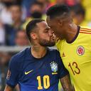 Brazil's Neymar (L) and Colombia's Yerry Mina (R) are seen during their South American qualification football match for the FIFA World Cup Qatar 2022 at the Metropolitano stadium in Barranquilla, Colombia, on October 10, 2021. (Photo by JUAN BARRETO / AFP)