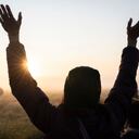 Spiritually-minded revellers celebrate sunrise during the summer Solstice (mid-summer and longest day) at the ancient late-Neolithic stones of Stonehenge, on 21st June 2023, in Wiltshire, England. The summer solstice is the northern hemisphere's longest day and shortest night of the year, when the earth's axis is tilted at its closest point from the sun and pagans say the ancient monument is a sacred place that links the Earth, Moon, Sun and the seasons. Stonehenge was built in three phases between 3,000 B.C. and 1,600 B.C. Stonehenge is owned by English Heritage who say 8,000 visitors were allowed into the ancient site for the 2023 solstice sunrise. (Photo by Richard Baker / In Pictures via Getty Images)