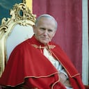 11/2/1982- Avila, Spain: Close-up of Pope John Paul II sitting on a chair, wearing red robes with a portrait of the St. Theresa of Avila in the background during his visit to Avila, Spain.