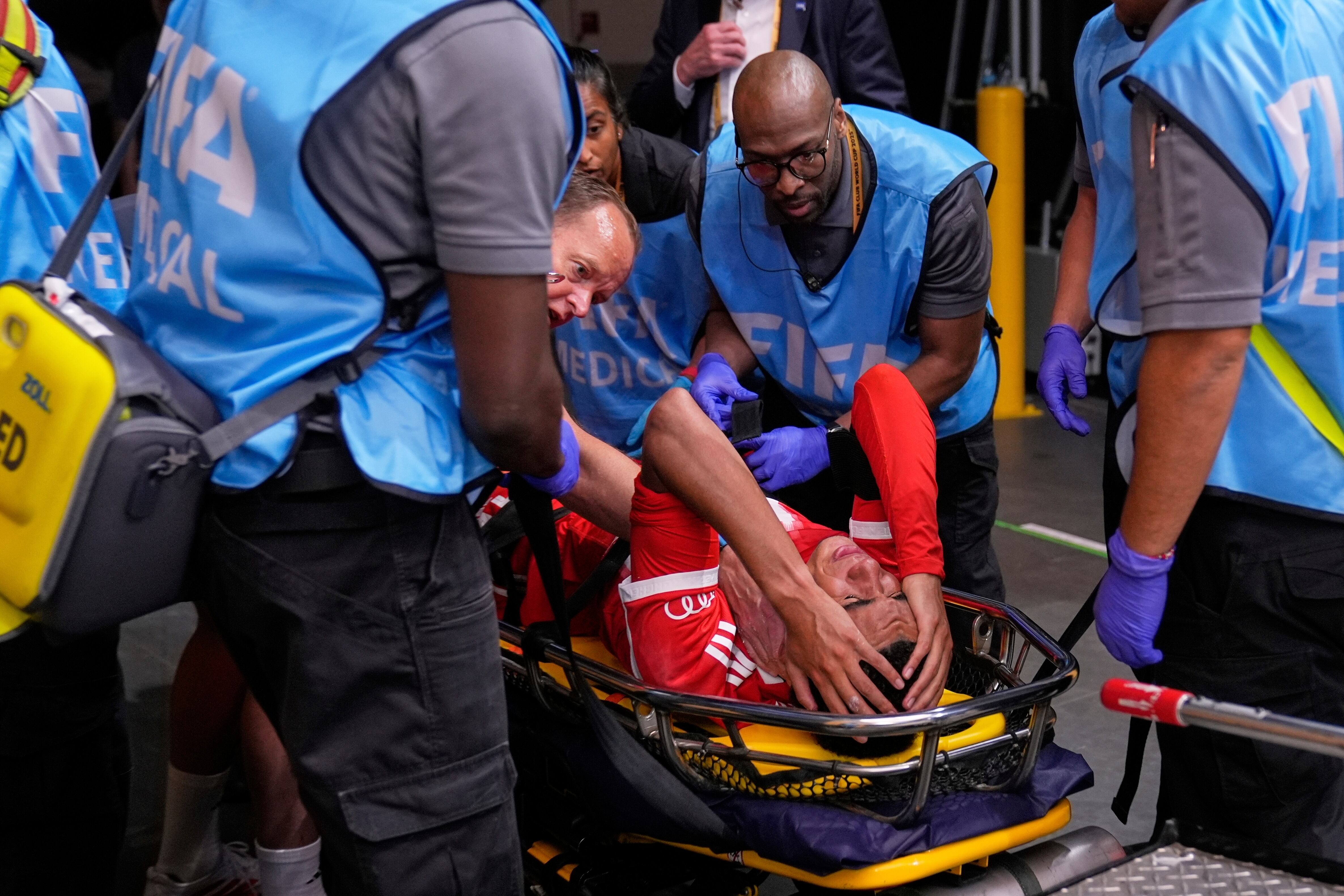 Bayern Munich's Jamal Musiala is taken off the field after an injury during the Club World Cup quarterfinal soccer match between PSG and Bayern Munich in Atlanta, Saturday, July 5, 2025. (AP Photo/Brynn Anderson)