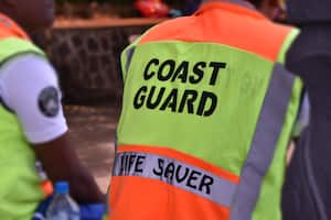 Photo of the back of a coast guard that watches over the banks of the river.