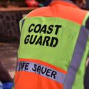 Photo of the back of a coast guard that watches over the banks of the river.