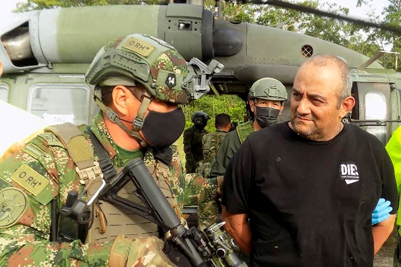 Dairo Antonio Usuga David, alias "Otoniel", top leader of the Gulf clan, is escorted by Colombian military after being captured, in Turbo