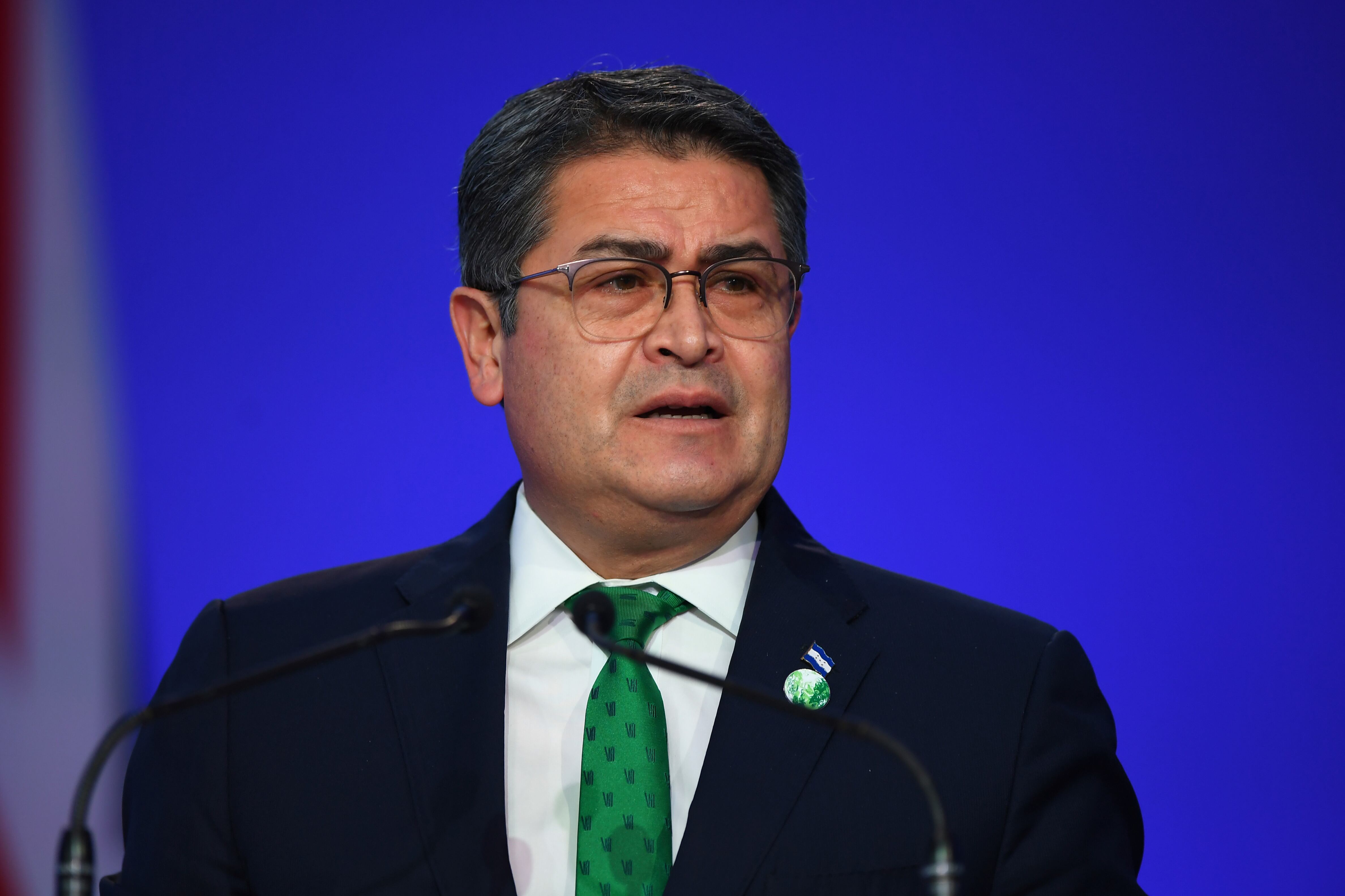 El presidente de Honduras, Juan Orlando Hernández, habla durante la ceremonia de apertura de la Conferencia de las Naciones Unidas sobre el Cambio Climático COP26 en Glasgow, Escocia, el lunes 1 de noviembre de 2021