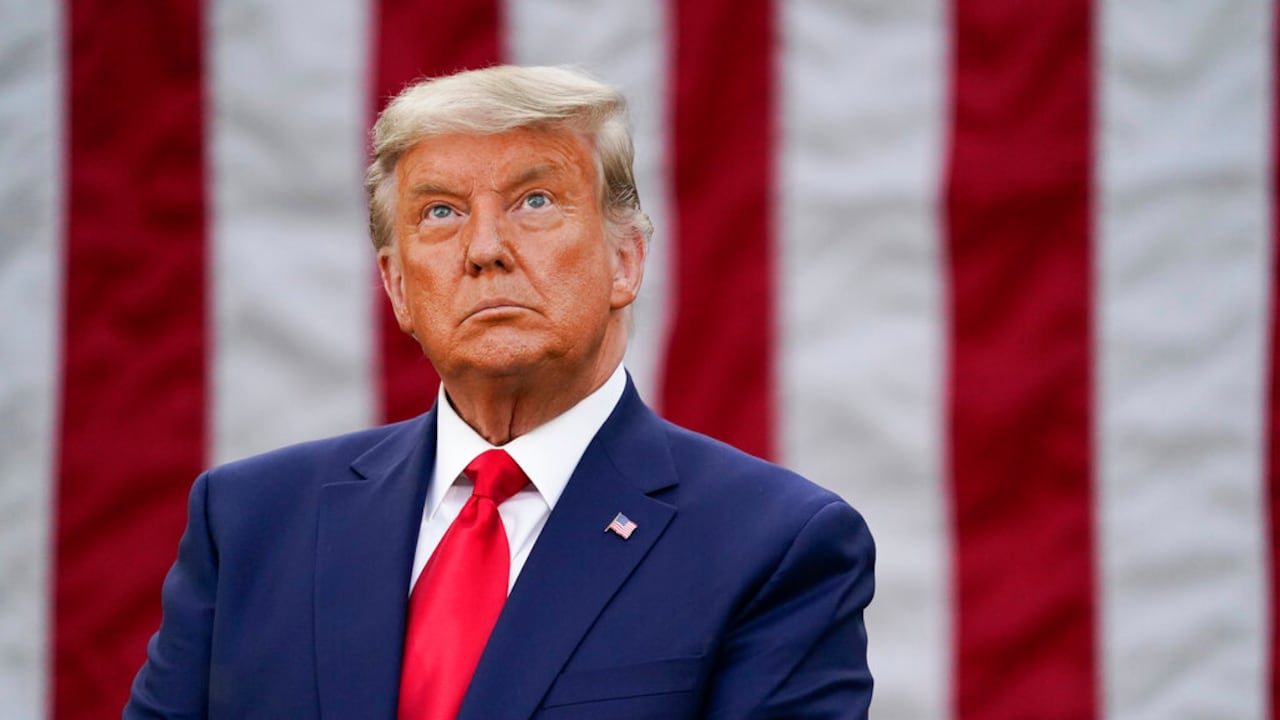 President Donald Trump listens attends an event on Operation Warp Speed in the Rose Garden of the White House, Friday, Nov. 13, 2020, in Washington. (AP Photo/Evan Vucci)