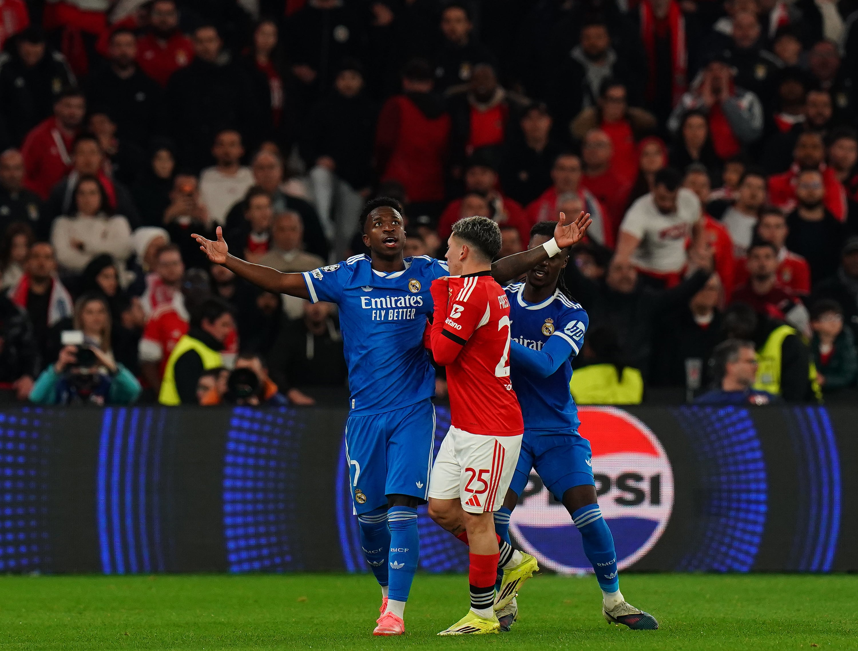 LISBON, PORTUGAL - FEBRUARY 17: Gianluca Prestianni of SL Benfica confronts Vinicius Junior of Real Madrid C.F. after Vinicius goal celebration during the UEFA Champions League 2025/26 League Knockout Play-off First Leg match between SL Benfica and Real Madrid C.F. at Estadio da Luz on February 17, 2026 in Lisbon, Portugal.  (Photo by Gualter Fatia/Getty Images)