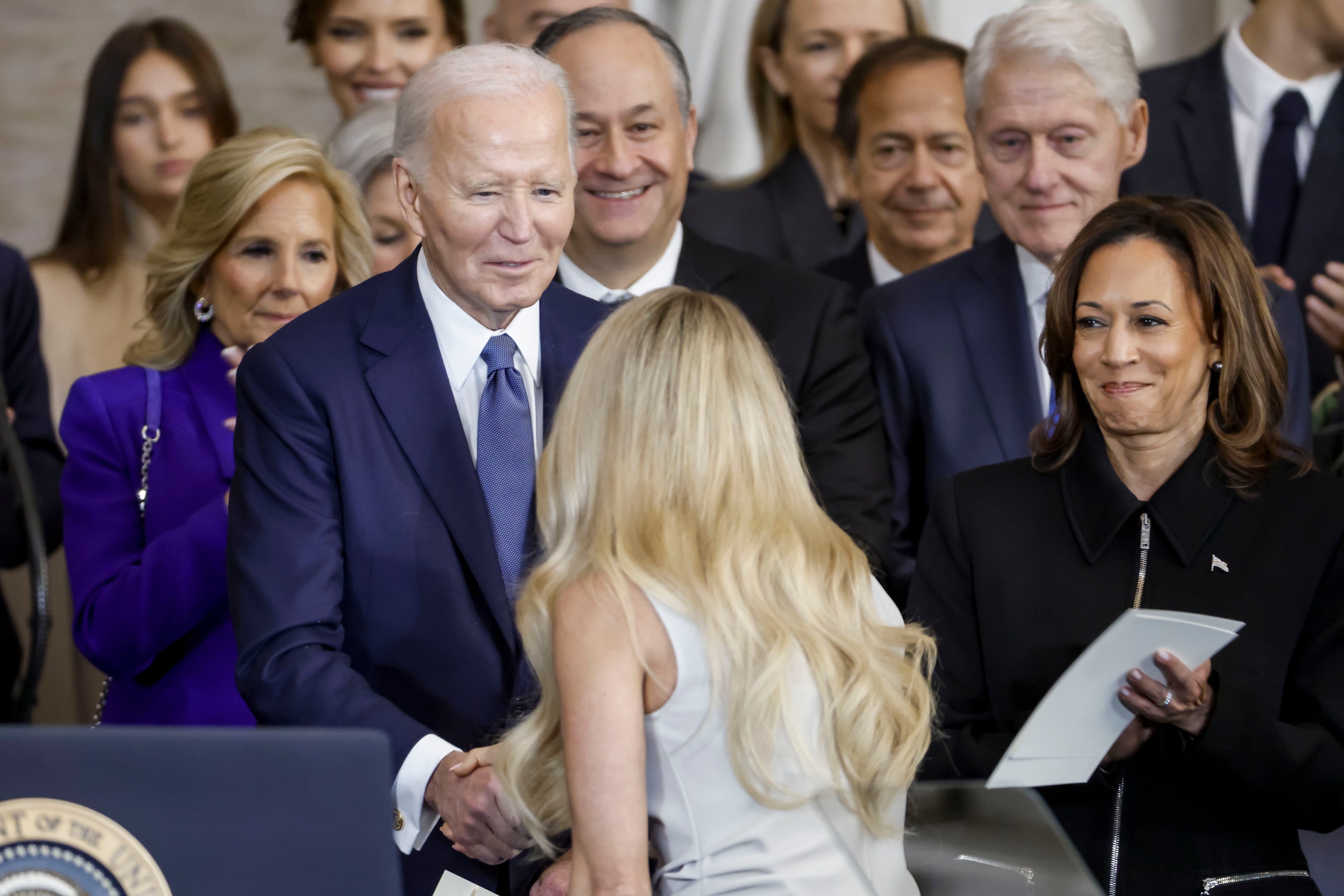 WASHINGTON, DC - JANUARY 20: Country singer Carrie Underwood (C) shakes hands with former US President Joe Biden (L) as former US Vice President Kamala Harris looks on after performing 'America the Beautiful' during US President Donald Trump's inauguration ceremony in the rotunda of the United States Capitol on January 20, 2025 in Washington, DC. Donald Trump takes office for his second term as the 47th President of the United States. (Photo by Shawn Thew-Pool/Getty Images)