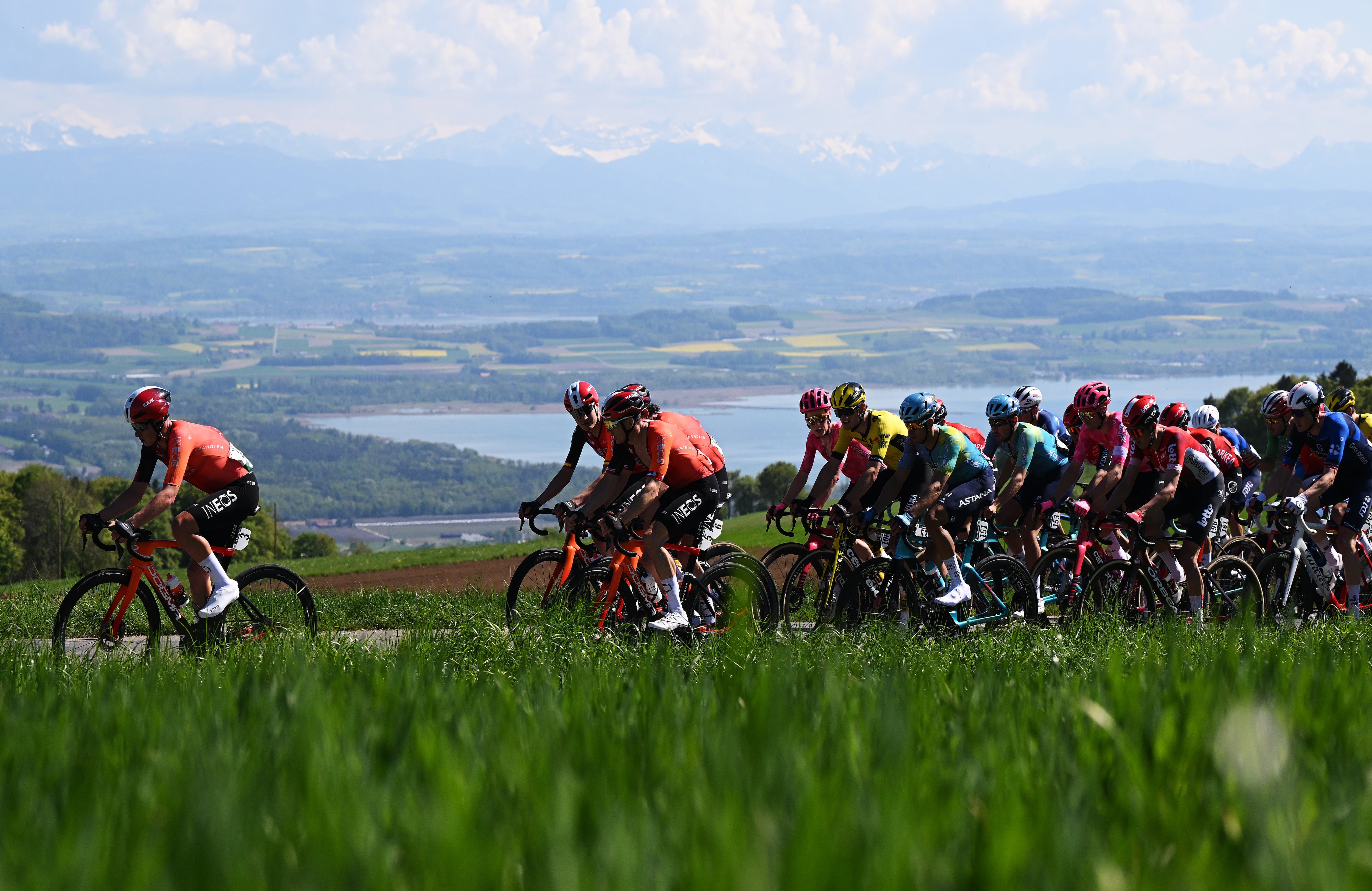 FRIBOURG, SWITZERLAND - APRIL 30: (L-R) Michael Leonard of Canada, Carlos Rodriguez of Spain, Ben Swift of Great Britain and Team INEOS Grenadiers, Archie Ryan of Ireland and Team EF Education-Easypost, Menno Huising of Netherlands and Team Visma | Lease A Bike, Harold Tejada of Colombia, Clement Champoussin of France and XDS Astana Team, Reuben Thompson of New Zealand and Team Lotto, Stefan Kung of Switzerland and Team Groupama - FDJ and a general view of the peloton competing during the 78th Tour De Romandie 2025, Stage 1 a 194.3km stage from Munchenstein to Fribourg / #UCIWT / on April 30, 2025 in Fribourg, Switzerland. (Photo by Dario Belingheri/Getty Images)