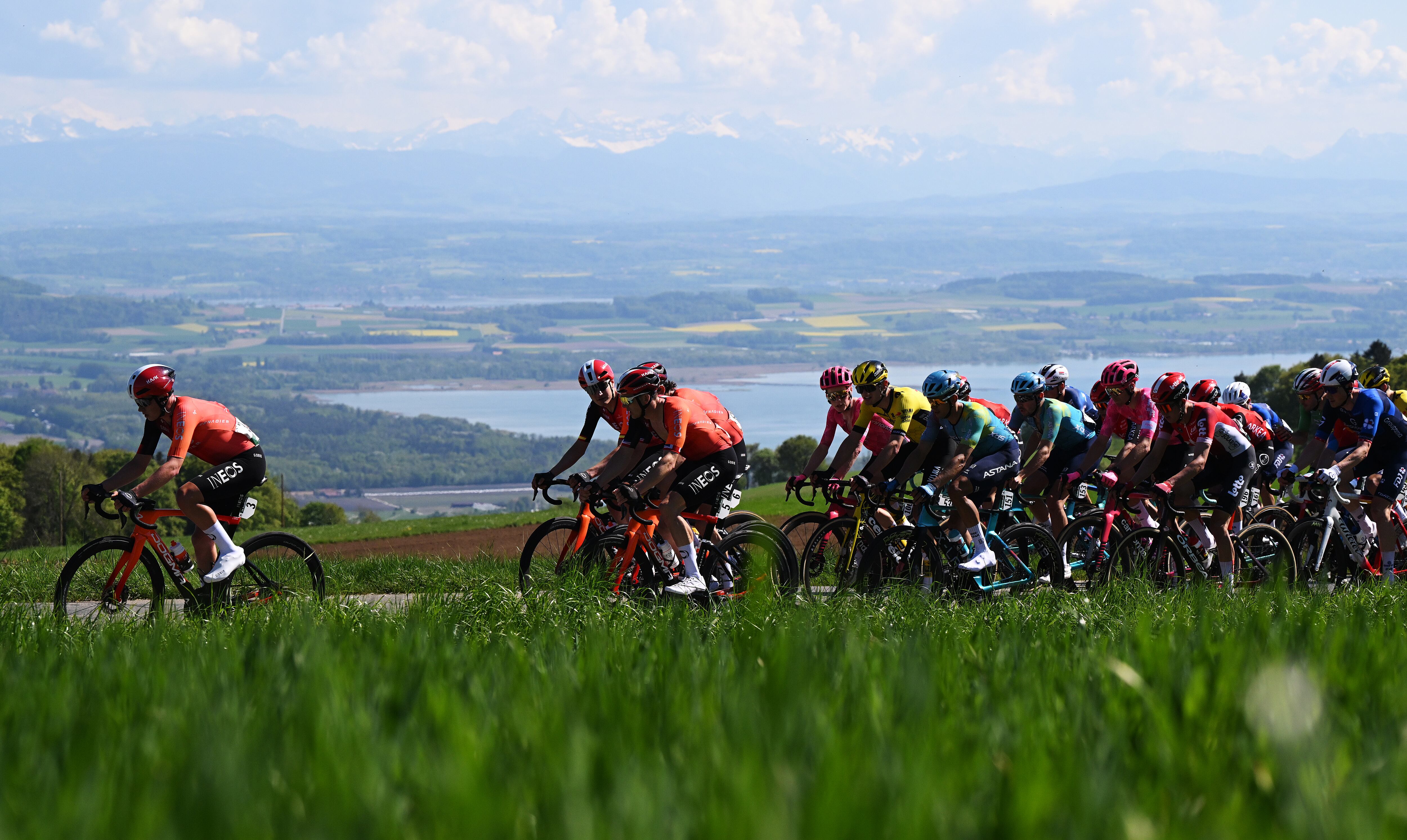 FRIBOURG, SWITZERLAND - APRIL 30: (L-R) Michael Leonard of Canada, Carlos Rodriguez of Spain, Ben Swift of Great Britain and Team INEOS Grenadiers, Archie Ryan of Ireland and Team EF Education-Easypost, Menno Huising of Netherlands and Team Visma | Lease A Bike, Harold Tejada of Colombia, Clement Champoussin of France and XDS Astana Team, Reuben Thompson of New Zealand and Team Lotto, Stefan Kung of Switzerland and Team Groupama - FDJ and a general view of the peloton competing during the 78th Tour De Romandie 2025, Stage 1 a 194.3km stage from Munchenstein to Fribourg / #UCIWT / on April 30, 2025 in Fribourg, Switzerland. (Photo by Dario Belingheri/Getty Images)
