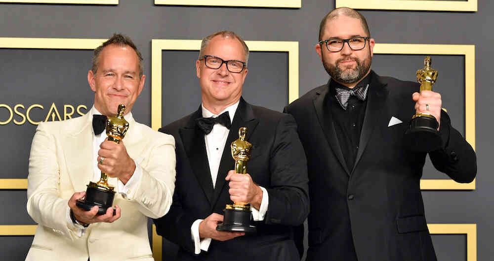 Los cineastas Jonas Rivera, Mark Nielsen y Josh Cooley, ganadores a mejor filme animado / AFP