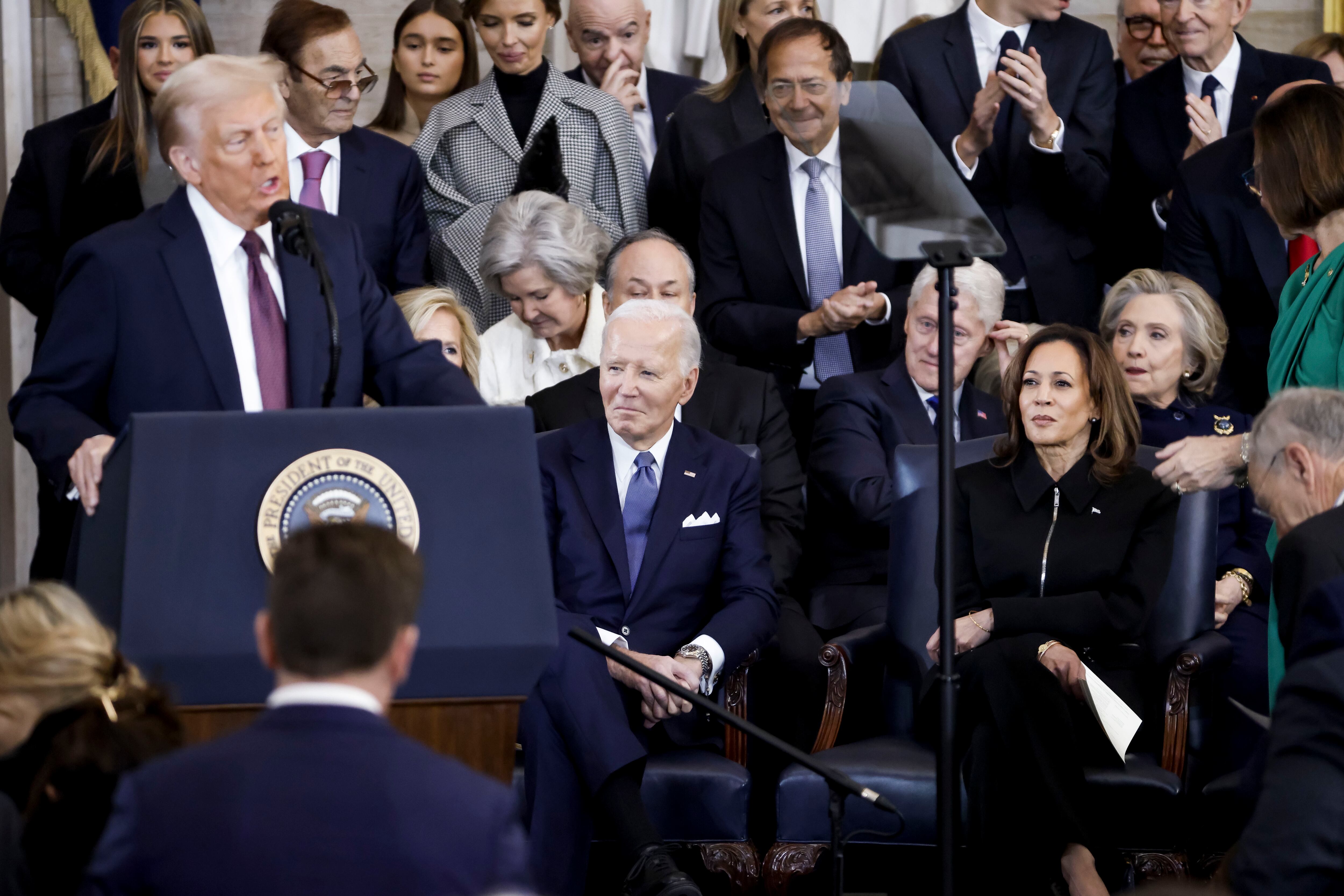WASHINGTON, DC - JANUARY 20: Former US President Joe Biden (2-R) and former US Vice President Kamala Harris (R) listen as US President Donald Trump (L) delivers remarks after being sworn in as the 47th president of the United States in an inauguration ceremony in the rotunda of the United States Capitol on January 20, 2025 in Washington, DC. Donald Trump takes office for his second term as the 47th President of the United States. (Photo by Shawn Thew-Pool/Getty Images)