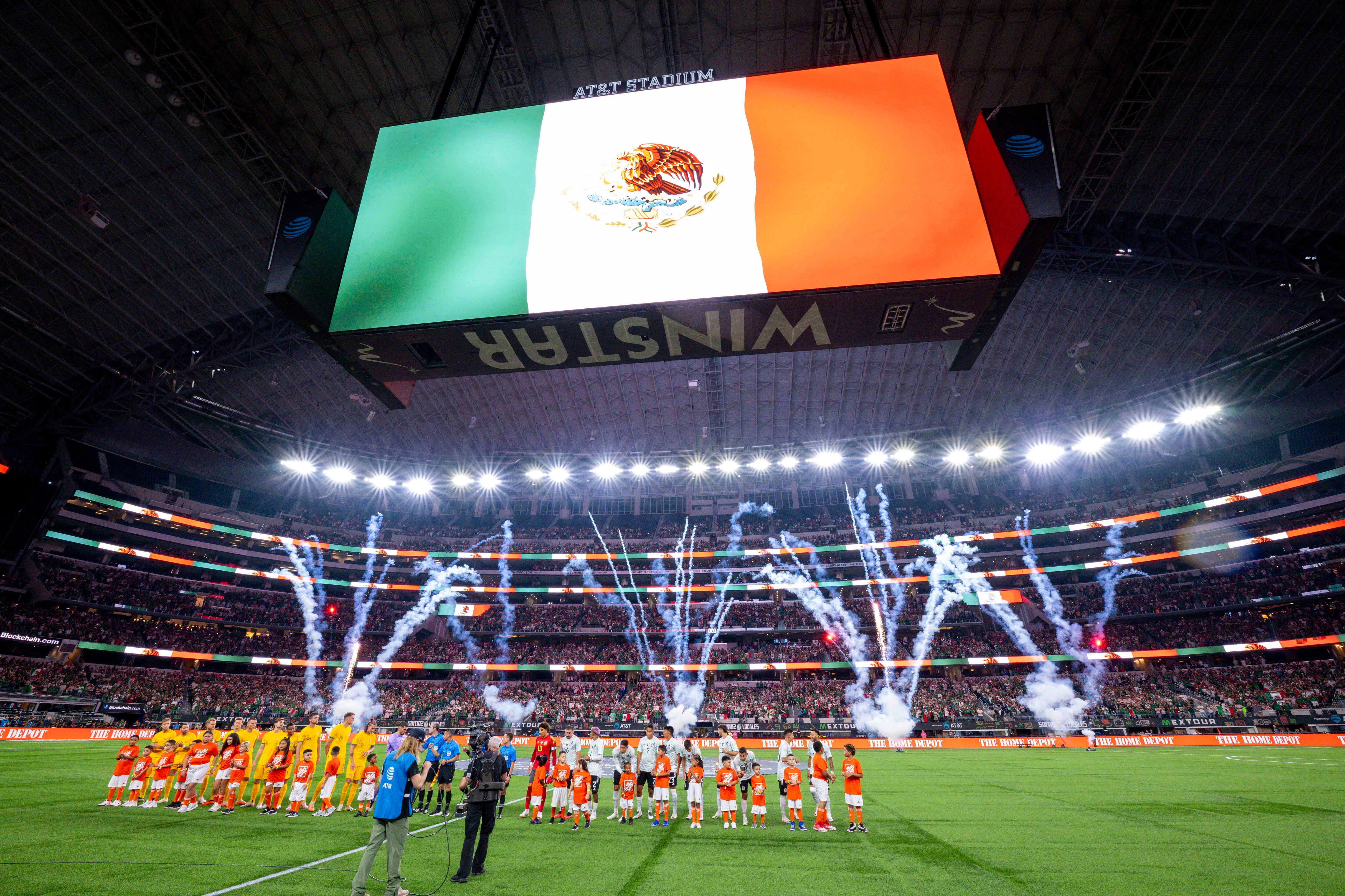 Sep 9, 2023; Arlington, TX, USA; A view of the stadium and the flag and and the fireworks and the Australia and Mexico teams during the playing of the Mexico national anthem before the game at AT&T Stadium. Mandatory Credit: Jerome Miron-USA TODAY Sports