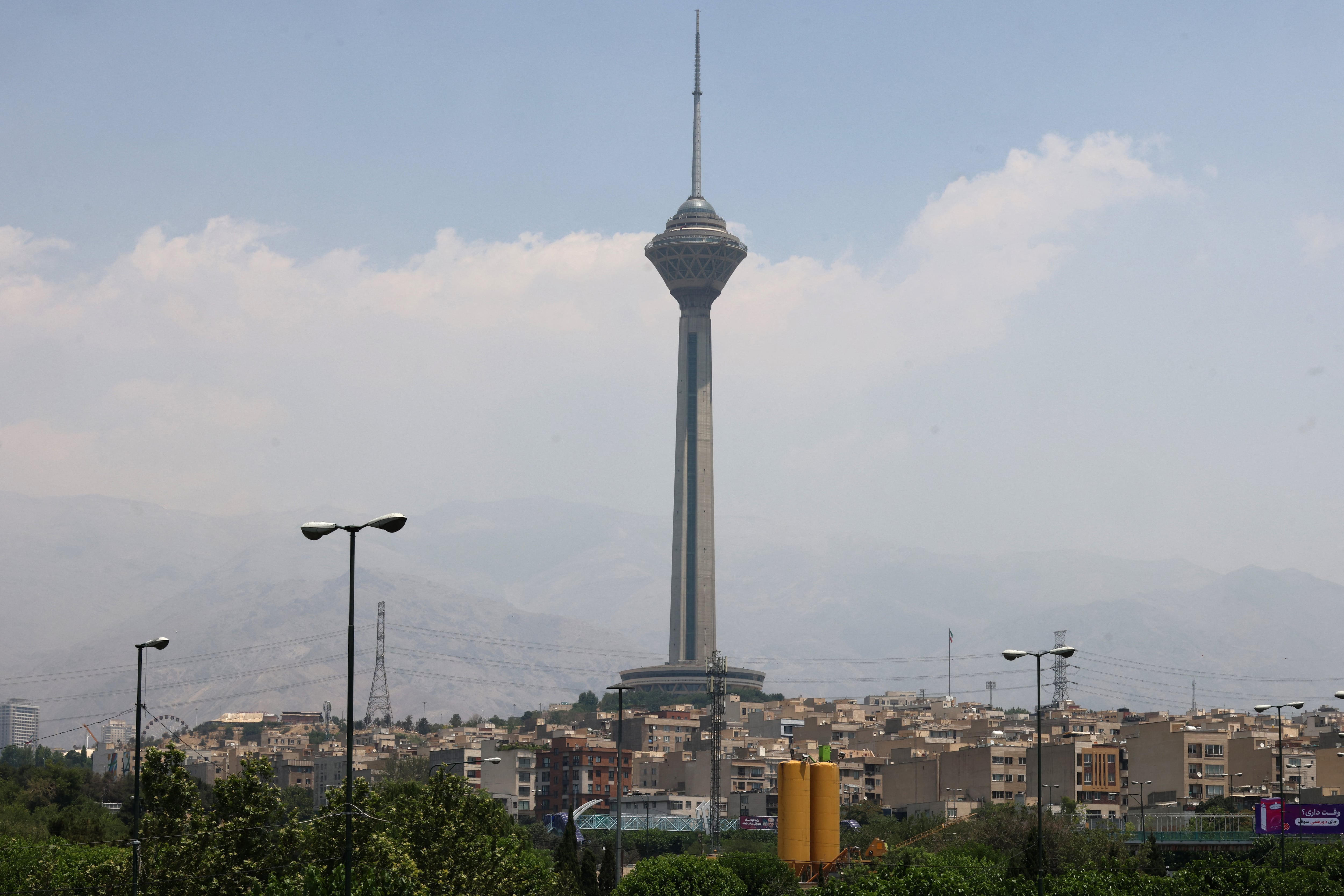 A general view shows the Milad Telecommunications Tower in Iran's capital Tehran on June 14, 2025. Israel's military said that its fighter jets were set to resume striking targets in Tehran, after announcing it had hit air defences in the Iranian capital area overnight, as Israel and Iran trade fire with such intensity for the first time following decades of enmity and conflict by proxy, with fears of a prolonged conflict engulfing the region. (Photo by Atta KENARE / AFP)