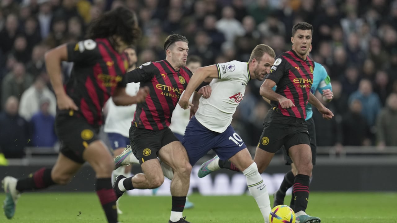 Tottenham's Harry Kane, 3rd left, is challenged by Manchester City's Jack Grealish, 2nd left, during an English Premier League soccer match between Tottenham Hotspur v Manchester City at the Tottenham Hotspur Stadium in London, Sunday, Feb. 5, 2023. (AP/Kin Cheung)