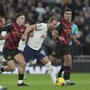 Tottenham's Harry Kane, 3rd left, is challenged by Manchester City's Jack Grealish, 2nd left, during an English Premier League soccer match between Tottenham Hotspur v Manchester City at the Tottenham Hotspur Stadium in London, Sunday, Feb. 5, 2023. (AP Photo/Kin Cheung)