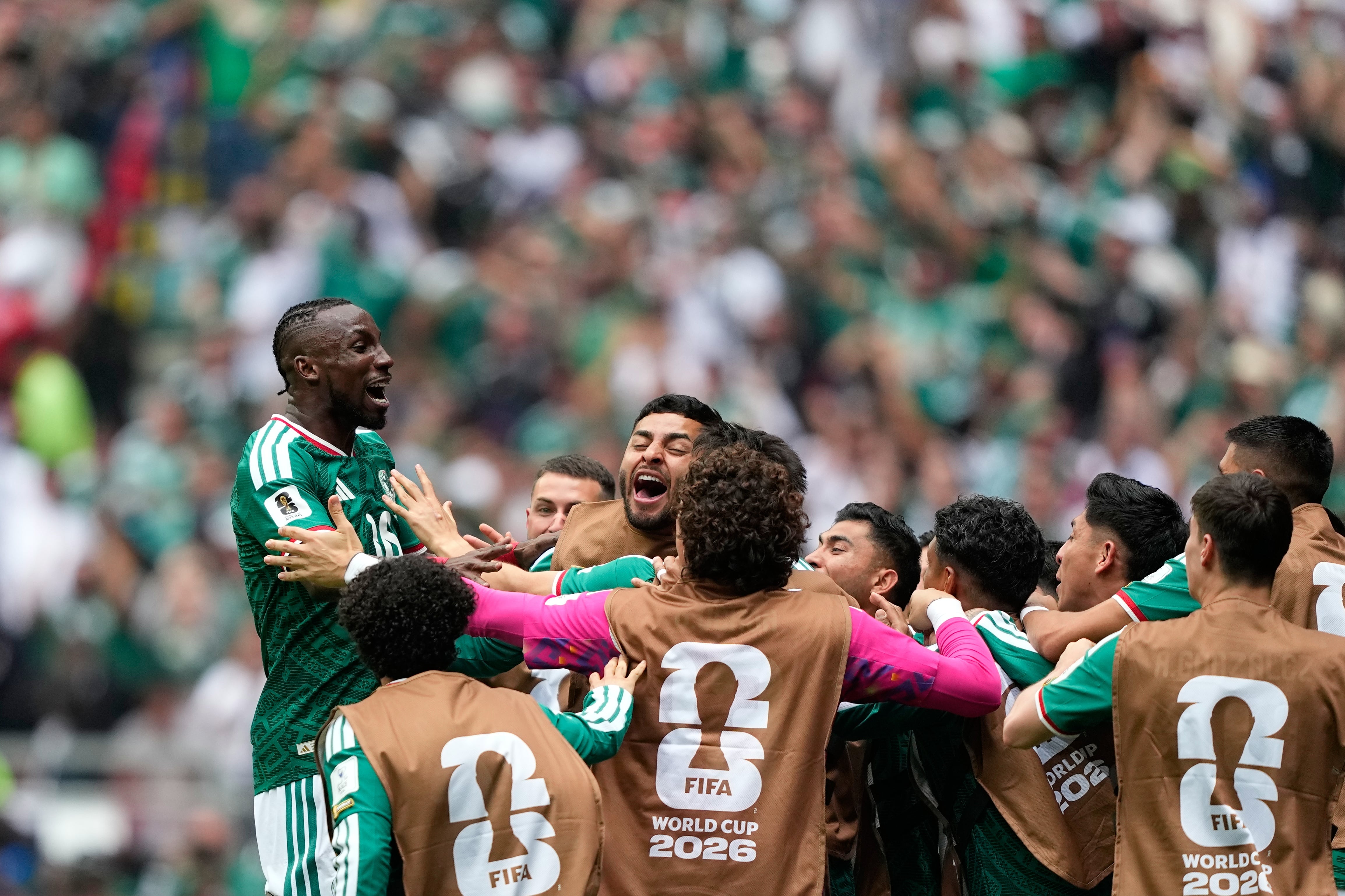 Mexico's Julian Quinones, left, celebrates after scoring the opening goal during the World Cup Group A soccer match between Mexico and South Africa in Mexico City, Thursday, June 11, 2026. (AP Photo/Natacha Pisarenko)