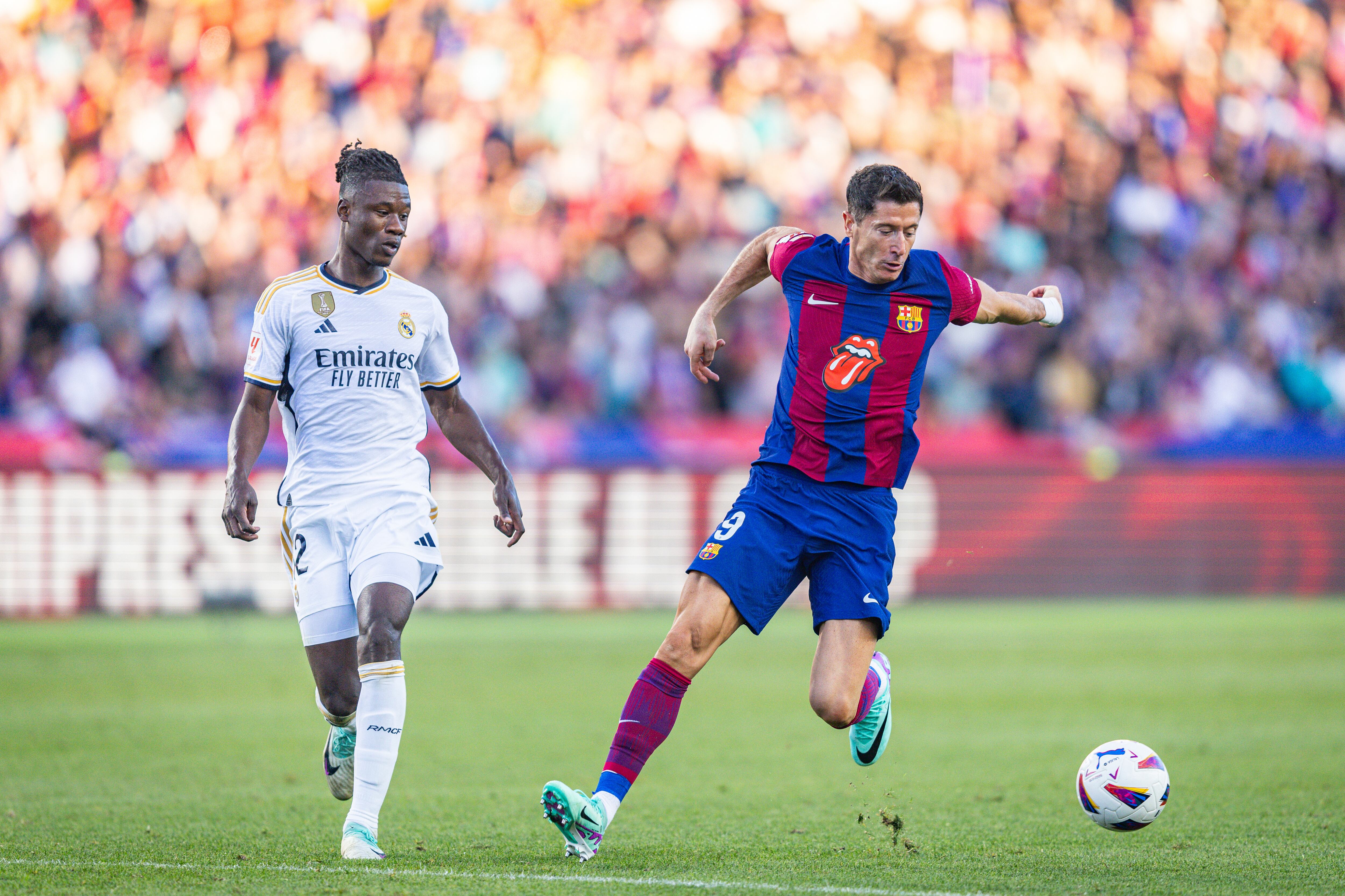 BARCELONA, SPAIN - 2023/10/28: Robert Lewandowski (Barcelona) (R) and Eduardo Camavinga (Real Madrid) (L) in action during the football match of Spanish championship La Liga EA Sports between Barcelona vs Real Madrid, better known as El Clasico, played at Olimpico de Montjuic stadium. Final score: Barcelona 1 : 2 Real Madrid. (Photo by Alberto Gardin/SOPA Images/LightRocket via Getty Images)