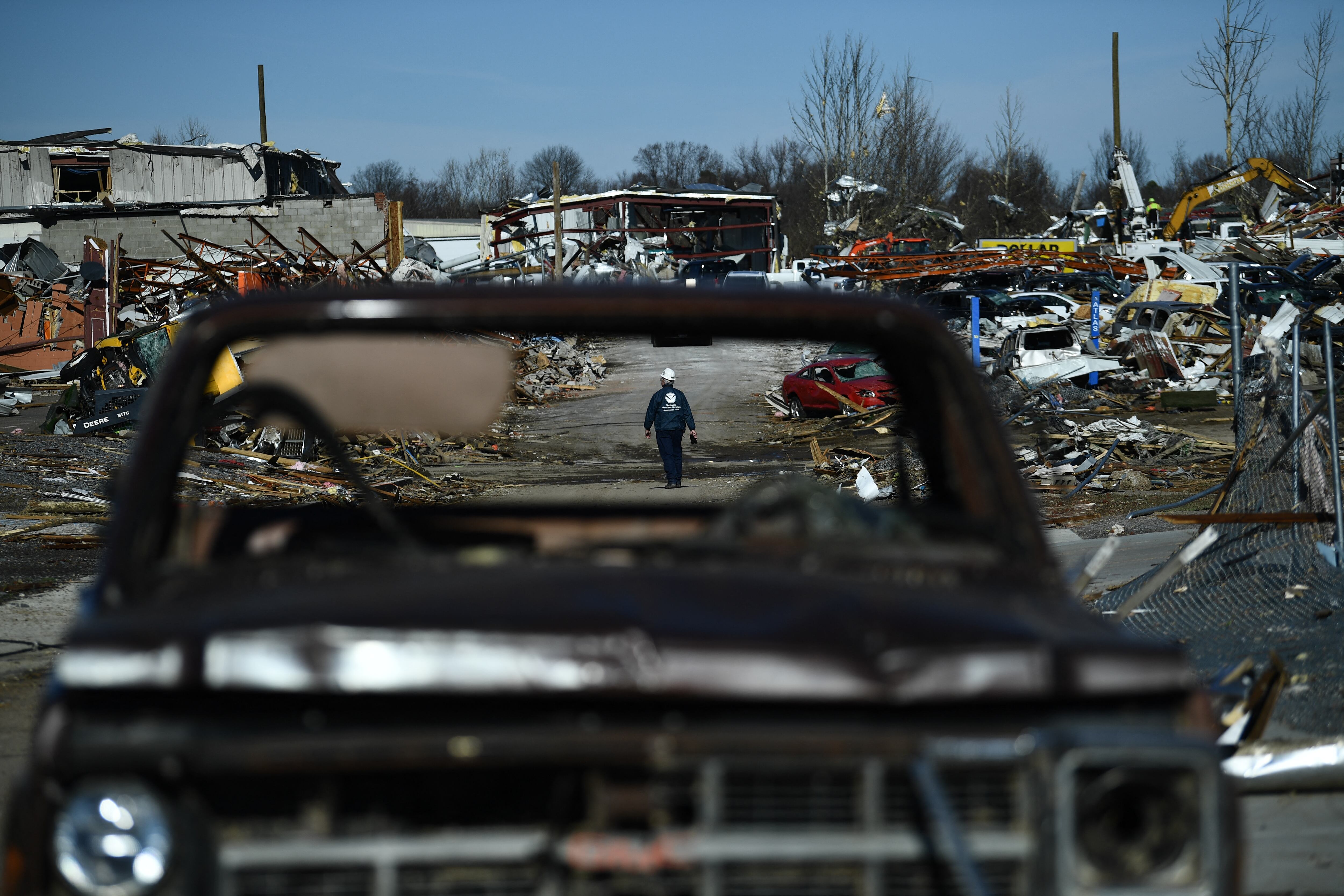 Tornado damage is seen after extreme weather hit the region December 12, 2021, in Mayfield, Kentucky. - Dozens of devastating tornadoes roared through five US states overnight, leaving more than 80 people dead Saturday in what President Joe Biden said was "one of the largest" storm outbreaks in history. (Photo by Brendan Smialowski / AFP)