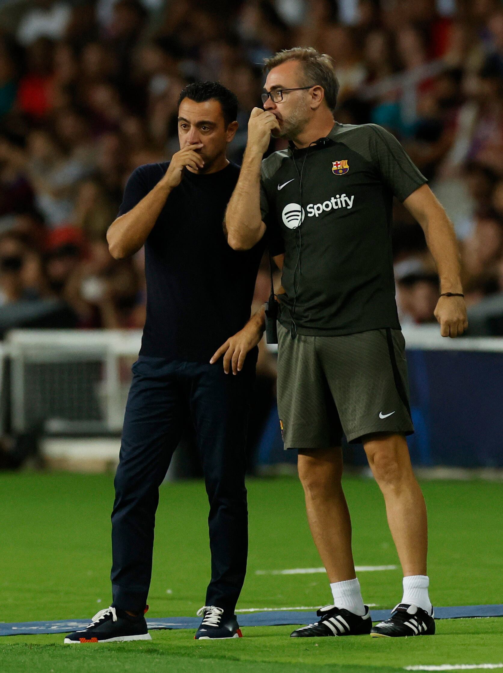 Soccer Football - Champions League - Group F - Paris St Germain v Borussia Dortmund - Parc des Princes, Paris, France - September 19, 2023 FC Barcelona coach Xavi with assistant coach Oscar Hernandez REUTERS/Albert Gea