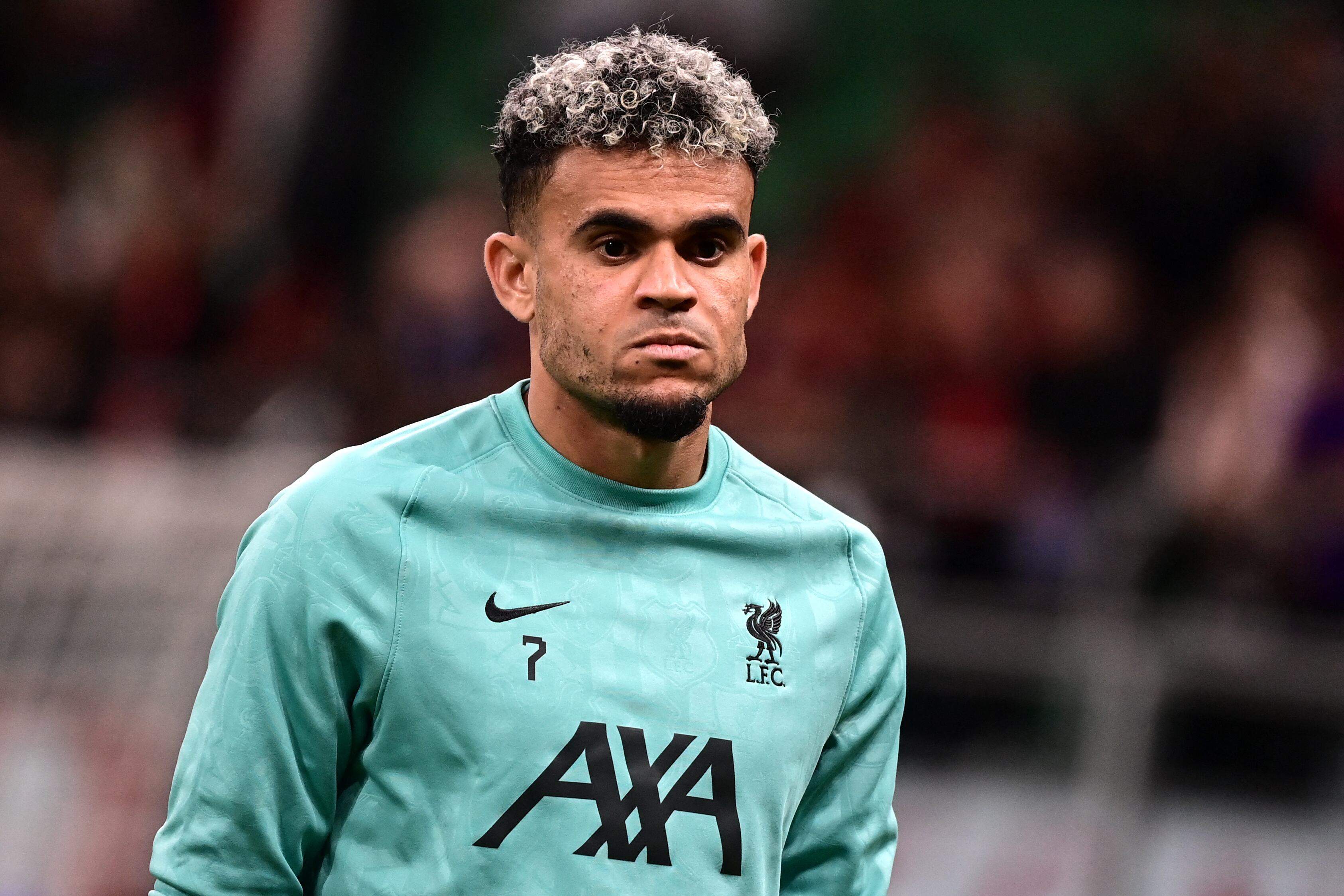 Liverpool's Colombian forward #07 Luis Diaz looks on as he warms up prior to the UEFA Champions League 1st round day 1 football match between AC Milan and Liverpool FC at the San Siro stadium in Milan on September 17, 2024. (Photo by PIERO CRUCIATTI / AFP)