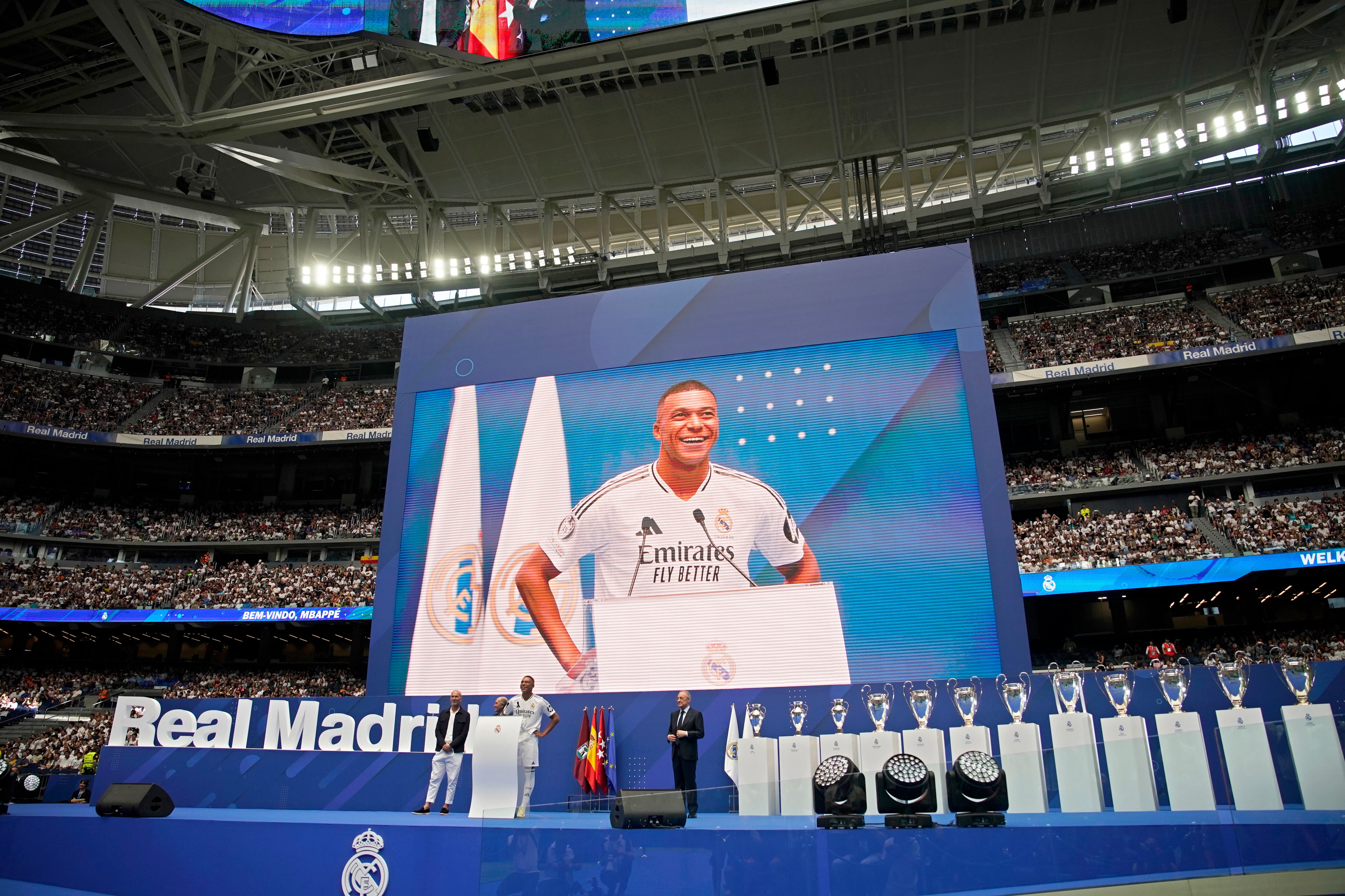 Kylian Mbappe, of France, is presented to fans as a new Real Madrid player at the Santiago Bernabeu stadium in Madrid, Tuesday, July 16, 2024. (AP Photo/Andrea Comas)