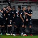 Frankfurt players celebrate their side's first goal during the Europa League Group D soccer match between Olympiacos and Eintracht Frankfurt at Georgios Karaiskakis in Piraeus port, near Athens, Greece, Thursday, Nov. 4, 2021. (AP Photo/Thanassis Stavrakis)