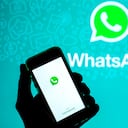 SPAIN - 2021/03/31: In this photo illustration, the WhatsApp app seen displayed on a smartphone screen and a WhatsApp in the background. (Photo Illustration by Thiago Prudêncio/SOPA Images/LightRocket via Getty Images)