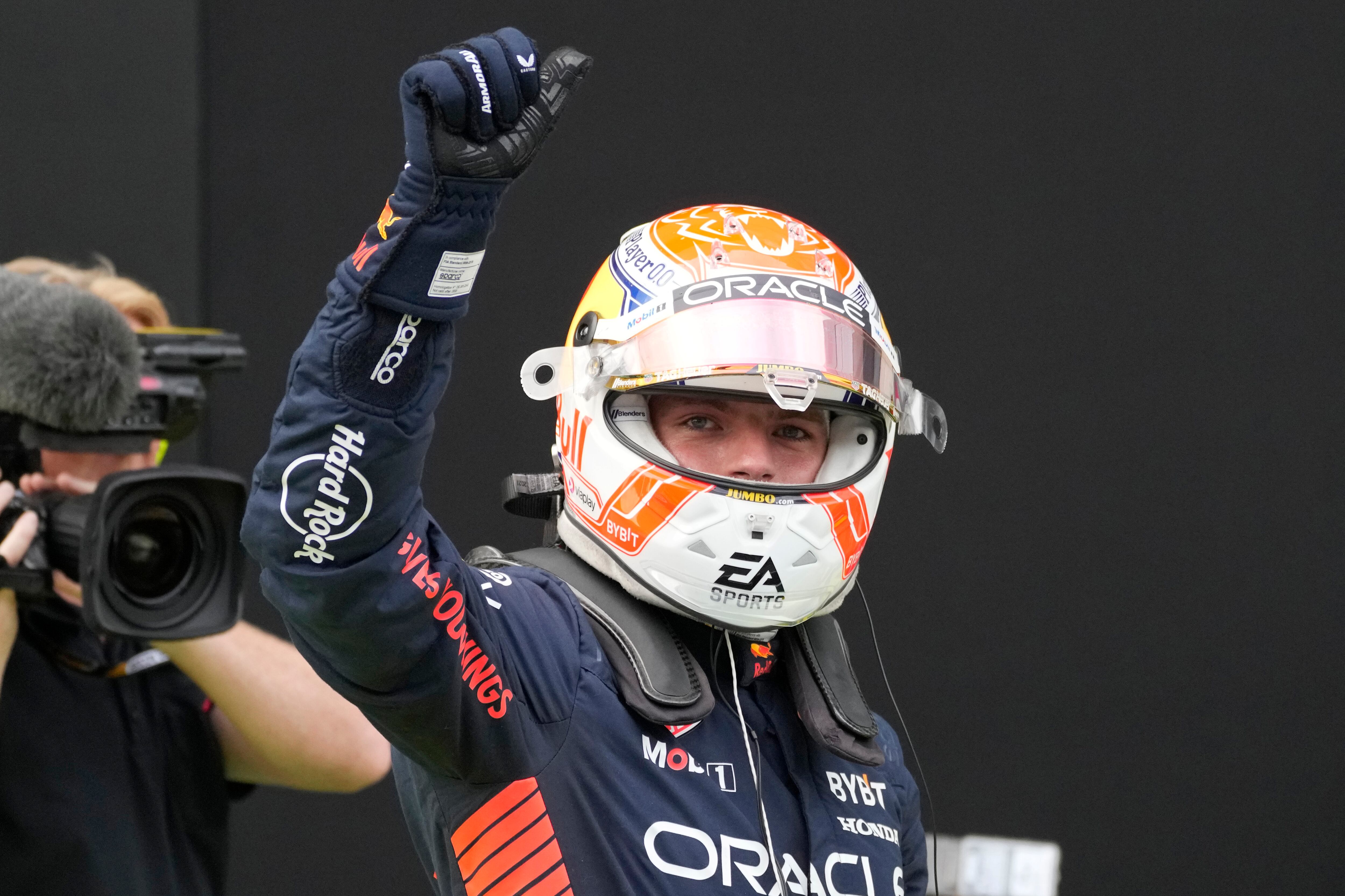 Red Bull driver Max Verstappen of the Netherlands gestures to the fans after clocking the fastest time in the qualifying session ahead of Sunday's Formula One Austrian Grand Prix auto race, at the Red Bull Ring racetrack, in Spielberg, Austria, Friday, June 30, 2023. (AP Photo/Darko Bandic, Pool)
