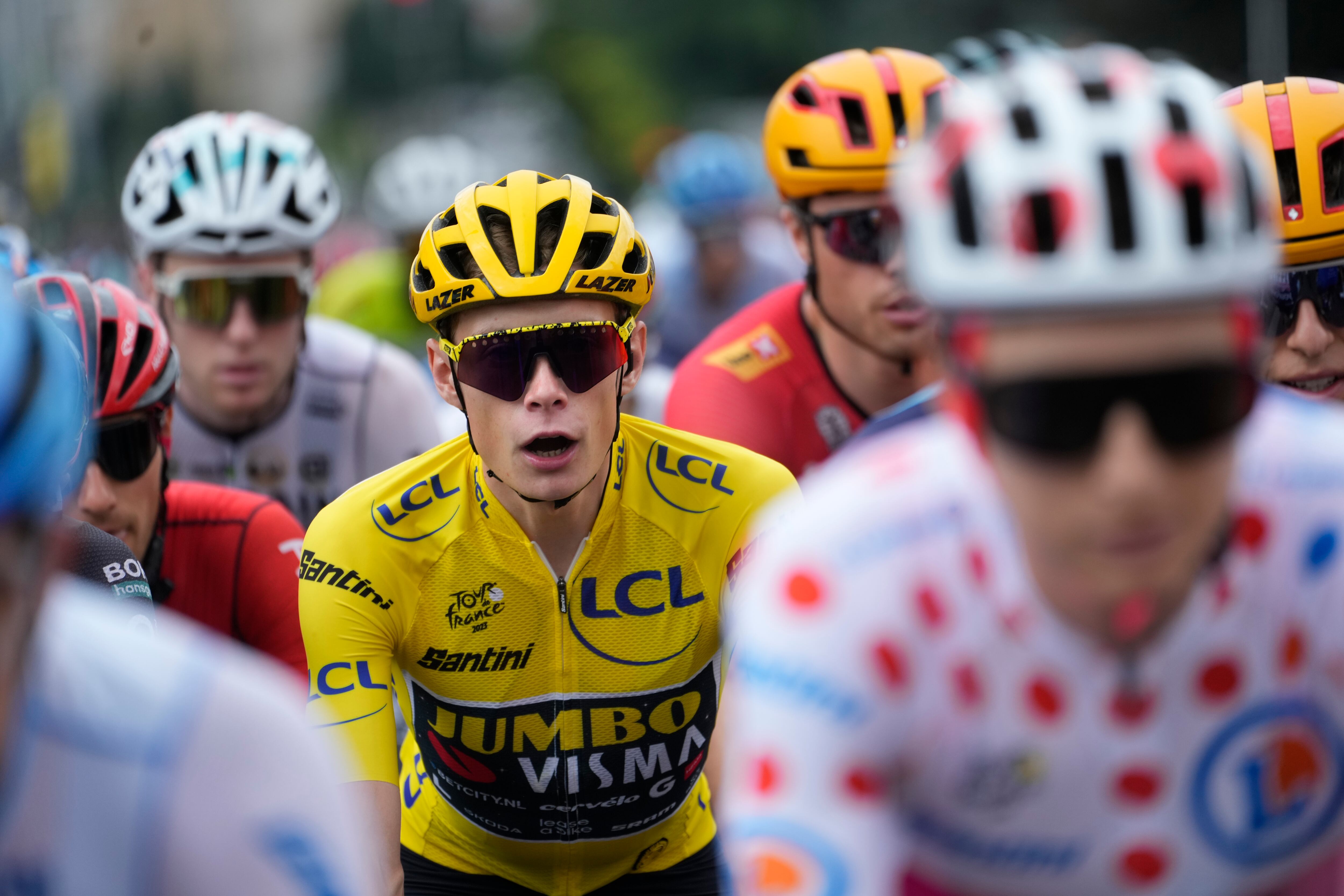 Denmark's Jonas Vingegaard, wearing the overall leader's yellow jersey, rides in the pack during the ceremonial parade of the fourteenth stage of the Tour de France cycling race over 152 kilometers (94.5 miles) with start in Annemasse and finish in Morzine Les Portes du Soleil, France, Saturday, July 15, 2023. (AP Photo/Thibault Camus)