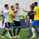 Brazil and Argentina's players talk as the soccer game is interrupted by health authorities during a qualifying soccer match for the FIFA World Cup Qatar 2022 at Neo Quimica Arena stadium in Sao Paulo, Brazil, Sunday, Sept.5, 2021. Federal police and health agency officers interrupted the South American classic shortly after it started in an operation that investigates the irregular entry of four players of Argentina into the country. (AP Photo/Andre Penner)