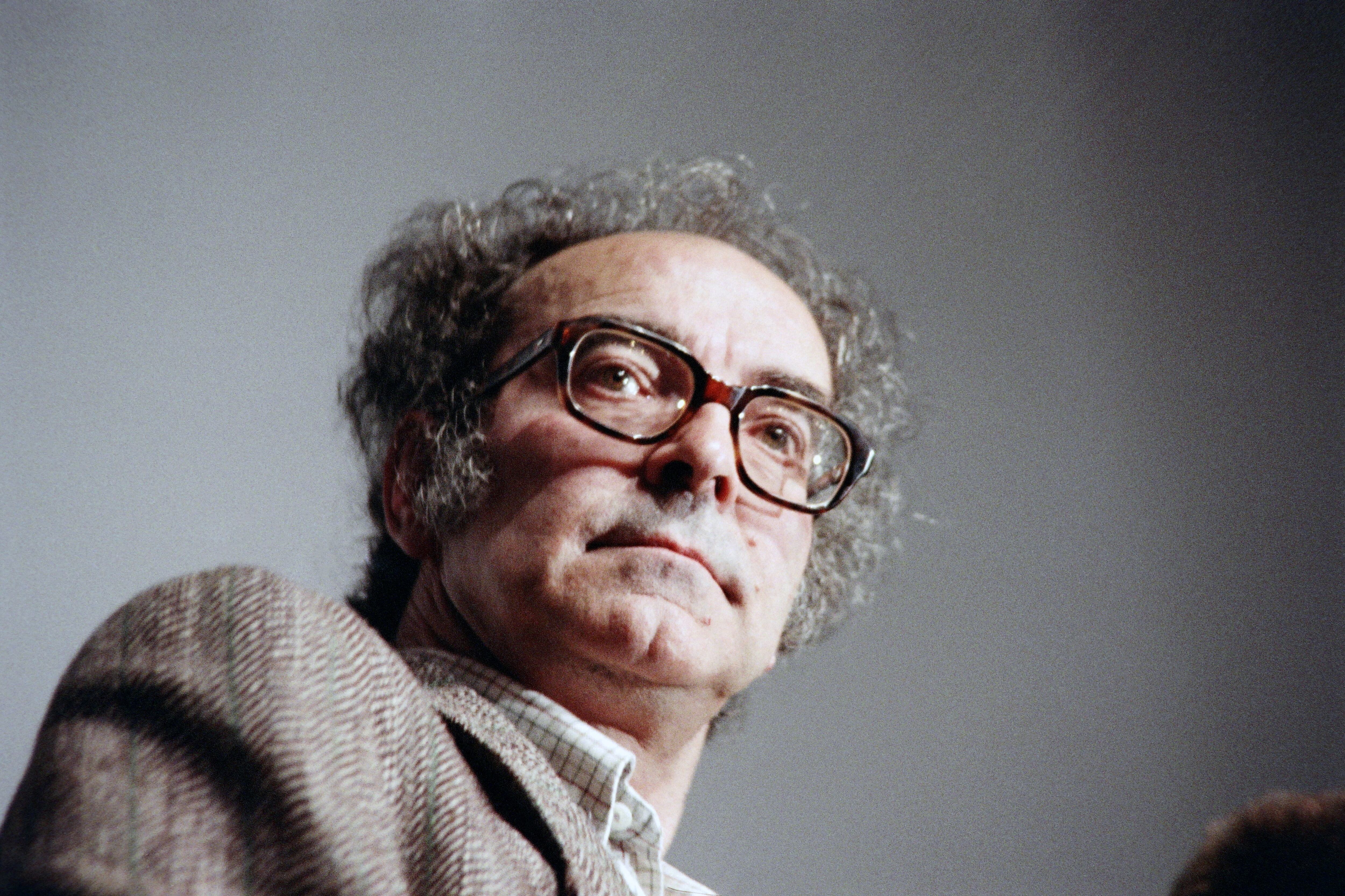 (FILES) In this file photo taken on May 21, 1988 Franco-Swiss film director Jean-Luc Godard attends a press conference during the Cannes International Film Festival in Cannes. - Franco-Swiss filmmaker Jean-Luc Godard, died "peacefully" on September 13, 2022 at his home in the small town of Rolle in Switzerland, his family said in a statement. (Photo by AFP)