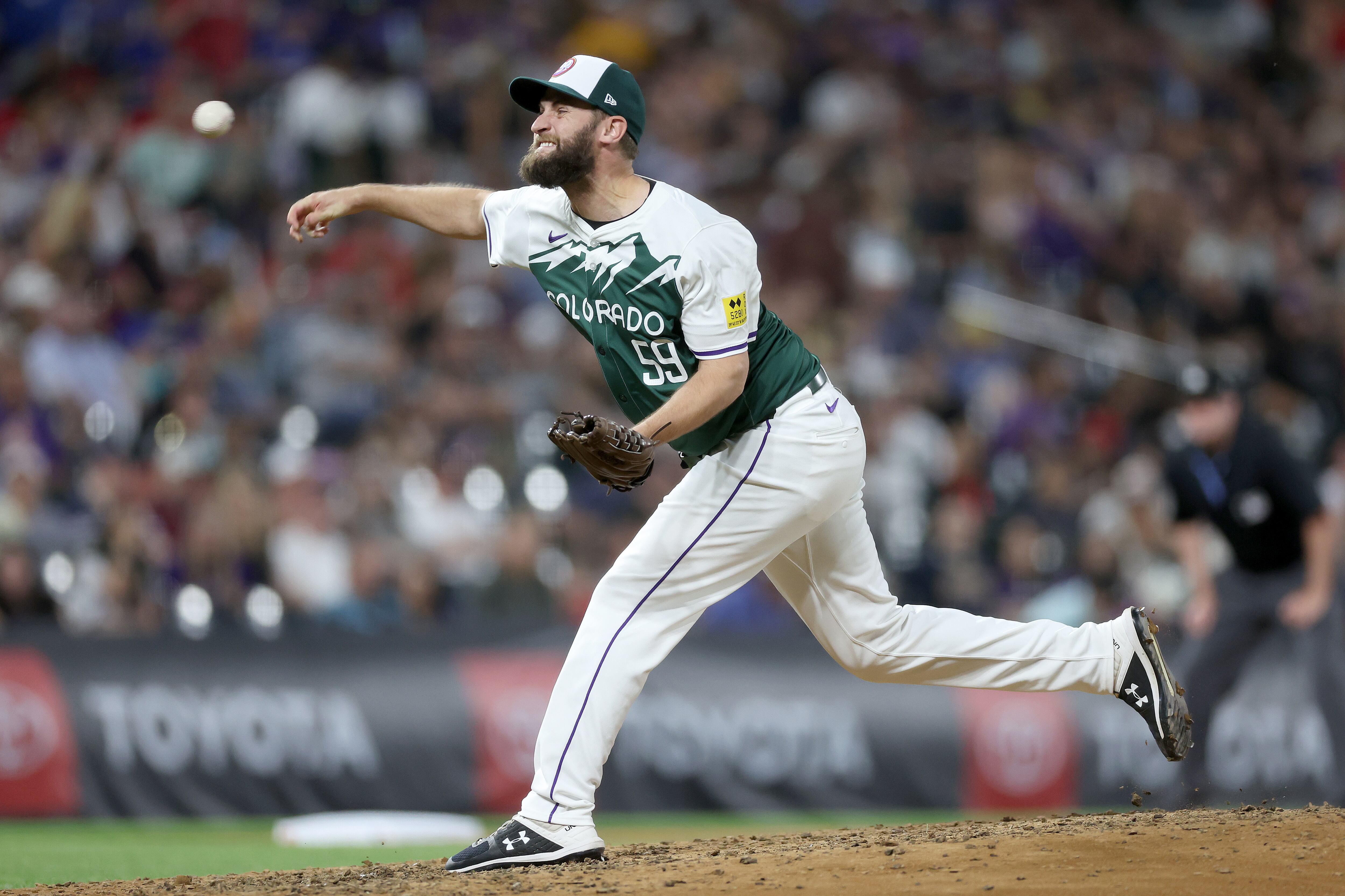 DENVER, COLORADO - JUNE 22: Pitcher Jake Bird #59 of the Colorado Rockies throws against the Washington Nationals in the seventh inning at Coors Field on June 22, 2024 in Denver, Colorado. (Photo by Matthew Stockman/Getty Images)