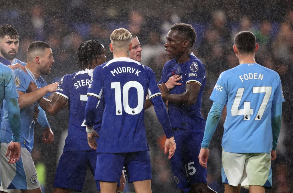 LONDON, ENGLAND - NOVEMBER 12: Mateo Kovacic of Manchester City clashes with Nicolas Jackson of Chelsea during the Premier League match between Chelsea FC and Manchester City at Stamford Bridge on November 12, 2023 in London, England. (Photo by Ryan Pierse/Getty Images)