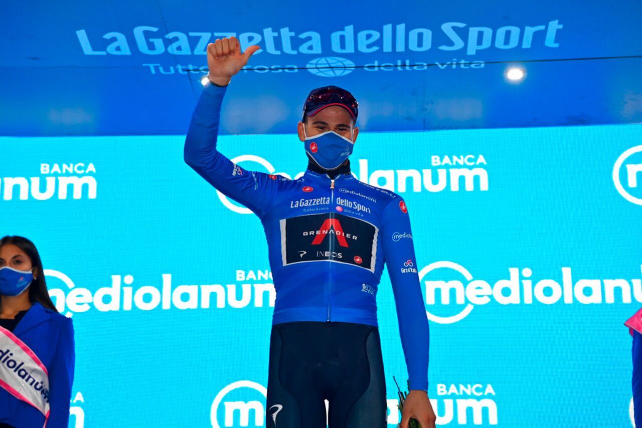 Filippo Ganna celebrates on the podium after winning the fifth stage of the Giro D'Italia, tour of Italy cycling race, from Mileto to Camigliatello Silano, Italy, Wednesday, Oct. 7, 2020. (Gian Mattia D'Alberto/LaPresse via AP)
