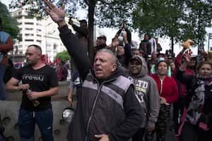 People shout slogans against the government during a demonstration in Buenos Aires, Argentina, Tuesday, May 9, 2023. Members of social organizations marched to protest government policies and demand higher salaries amid inflation. (AP Photo/Victor R. Caivano)