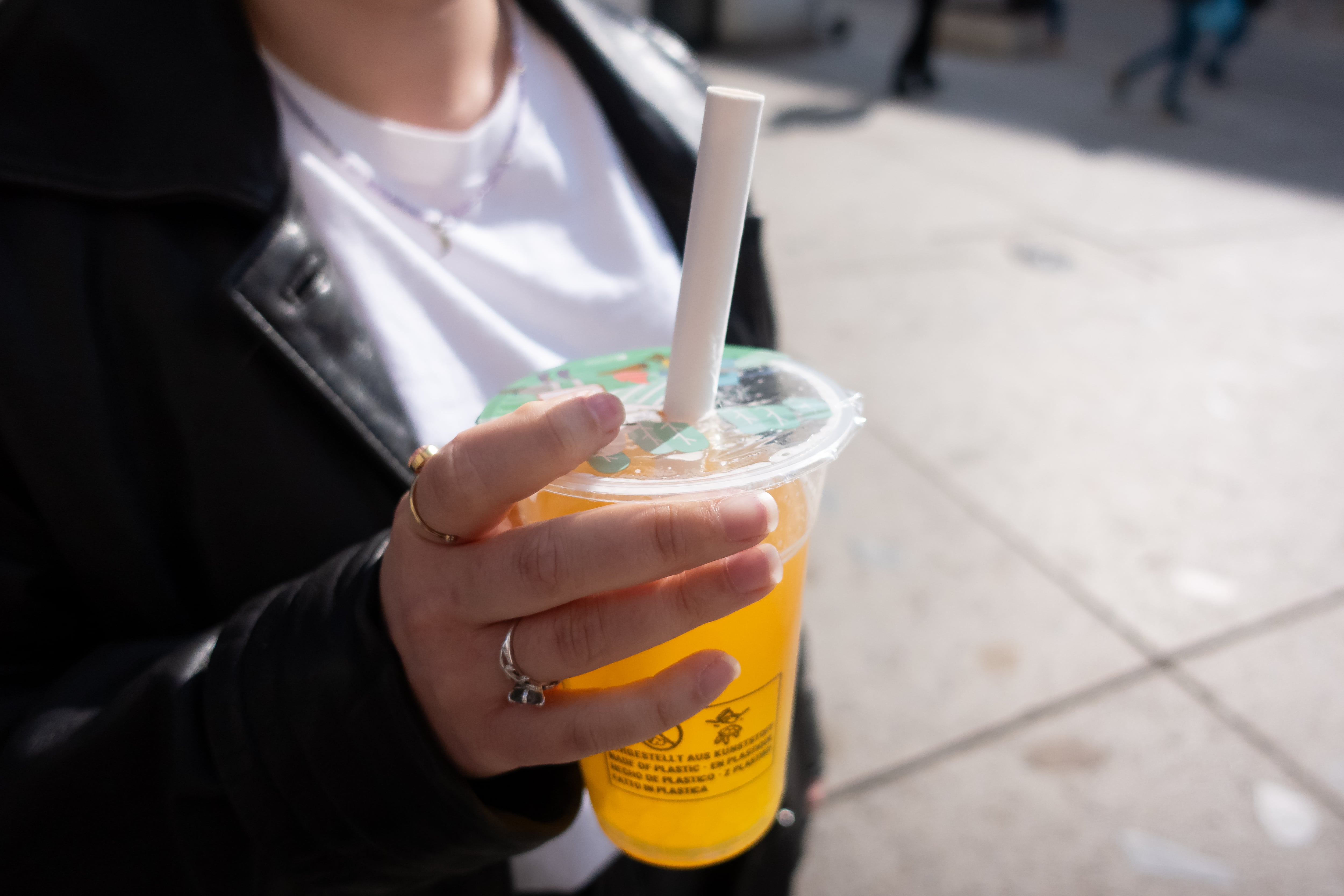 A woman's hand holds a cup of yellow bubble tea with popping pearls in Warsaw, Poland, on March 23, 2026. Bubble tea is a tea-based drink commonly served with tapioca or flavored pearls. (Photo by Mateusz Wlodarczyk/NurPhoto via Getty Images)