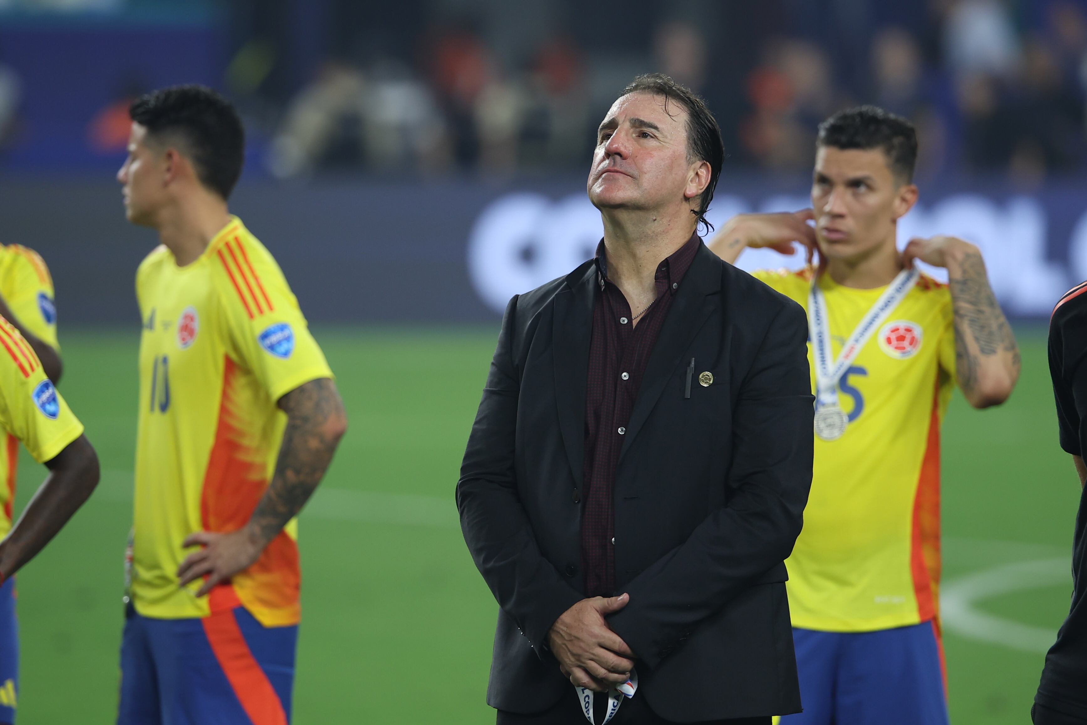 MIAMI GARDENS, FL - JULY 14: Colombia manager Nestor Lorenzo watches the post game ceremony following the Copa America Finals match between Colombia and Argentina on Sunday, July 14 2024 at Hard Rock Stadium in Miami Gardens, Fla. (Photo by Peter Joneleit/Icon Sportswire via Getty Images)