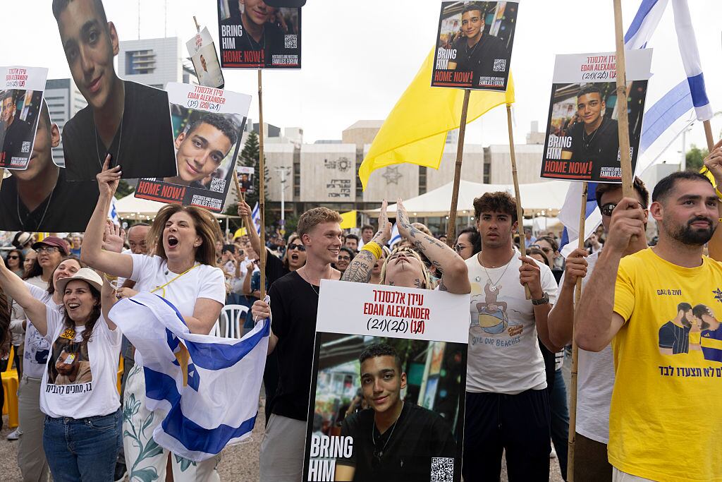 TEL AVIV, ISRAEL - MAY 12: Supporters react as they watch a live stream of the release of hostage Edan Alexander in the at Tel Aviv's hostages square on May 12, 2025 in Tel Aviv, Israel. Hamas announced yesterday that it would release Edan Alexander, an American citizen who was serving in the Israeli military when he was taken captive on Oct. 7 2023. He is the last Oct. 7 captive who holds American citizenship. (Photo by Amir Levy/Getty Images)
