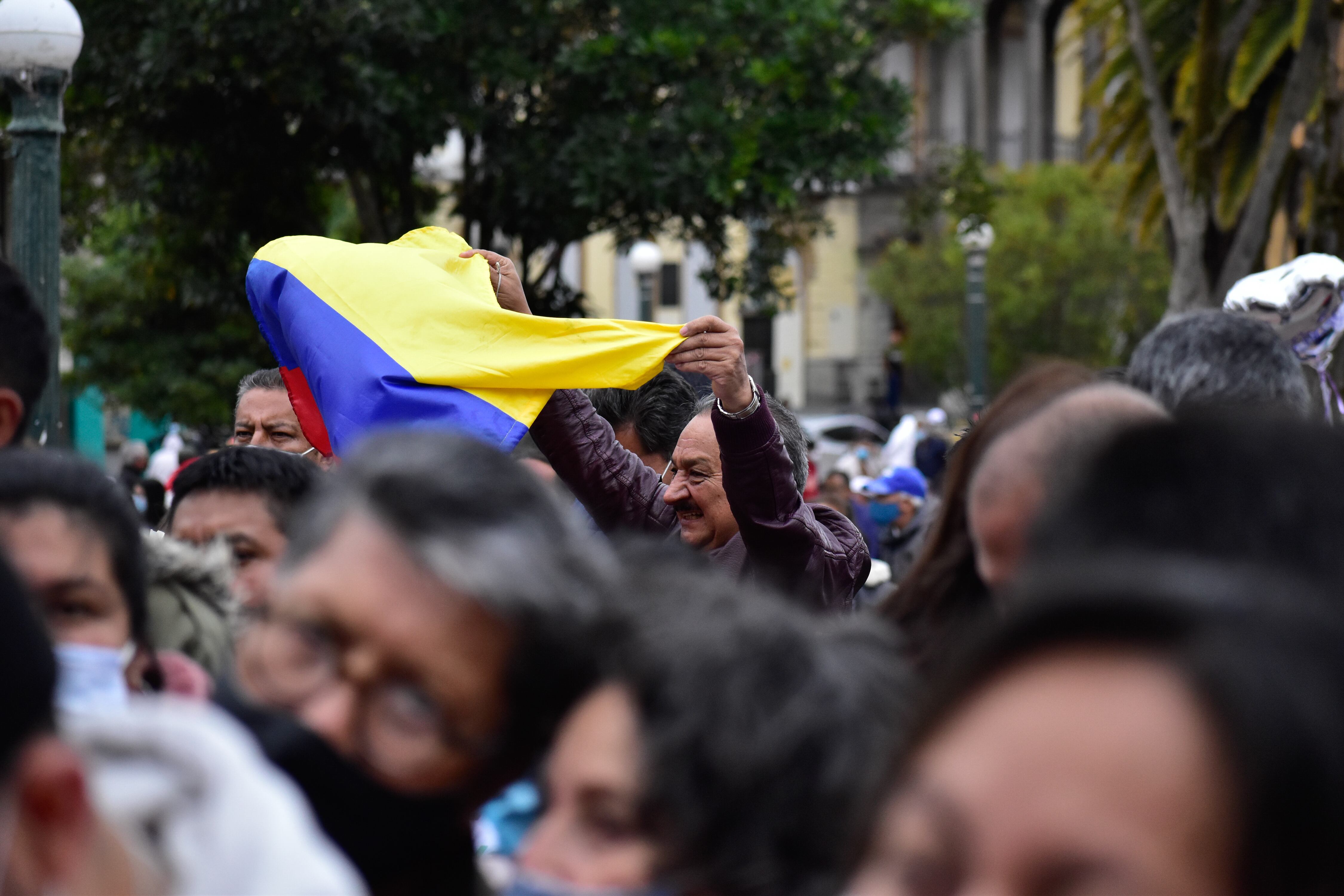 A suporter waves the Colombian flag during the candidacy announcement of a popular poll to determine the Historic Alliance between candidates Gustavo Petro, Francia Marquez and Arelis Uriana to run for Colombia's presidency on the 2022 Elections, in Pasto, Narino - Colombia, on September 25, 2021. (Photo by: Camilo Erasso/Long Visual Press/Universal Images Group via Getty Images)