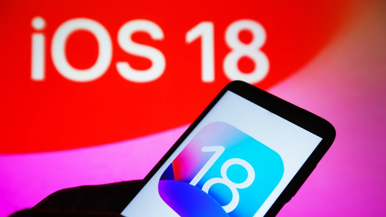 UKRAINE - 2023/09/22: In this photo illustration, iOS 18 logo is seen on a smartphone and on a pc screen in the background. (Photo Illustration by Pavlo Gonchar/SOPA Images/LightRocket via Getty Images)