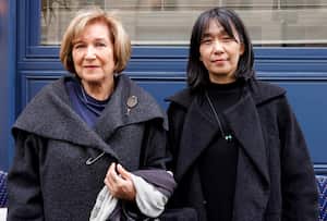 Portuguese author Lidia Jorge (L) and South Korean author Han Kang pose after winning jointly the Medicis Prize for a foreign novel in Paris on November 9, 2023. (Photo by Geoffroy VAN DER HASSELT / AFP)