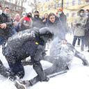A policeman detains a man while protesters try to help him, during a protest against the jailing of opposition leader Alexei Navalny in St. Petersburg, Russia, Sunday, Jan. 31, 2021. Thousands of people have taken to the streets across Russia to demand the release of jailed opposition leader Alexei Navalny, keeping up the wave of nationwide protests that have rattled the Kremlin. Hundreds have been detained by police. (AP Photo/Valentin Egorshin)