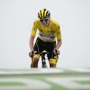 Slovenia's Tadej Pogacar, wearing the overall leader's yellow jersey, crosses the finish line to win the seventeenth stage of the Tour de France cycling race over 178.4 kilometers (110.9 miles) with start in Muret and finish in Saint-Lary-Soulan Col du Portet, France, Wednesday, July 14, 2021. (AP Photo/Christophe Ena)