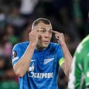 Zenit's Artem Dzyuba, left, reacts during the Europa League play off, second leg soccer match between Betis and Zenit at the Benito Villamarin stadium in Seville, Spain, Thursday, Feb. 24, 2022. (AP Photo/Miguel Morenatti)