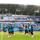 Chelsea players jog around the pitch during a training session at Windsor Park in Belfast, Northern Ireland, Tuesday, Aug. 10, 2021. Chelsea and Villarreal will meet in the UEFA Super Cup in Belfast on Wednesday. (AP Photo/Peter Morrison)