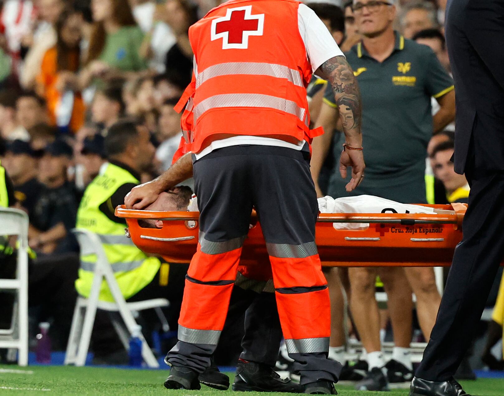 Real Madrid's Spanish defender #02 Dani Carvajal injured leaves the pitch on a stretcher during the Spanish league football match between Real Madrid CF and Villarreal CF at the Santiago Bernabeu stadium in Madrid on October 5, 2024. (Photo by OSCAR DEL POZO / AFP)